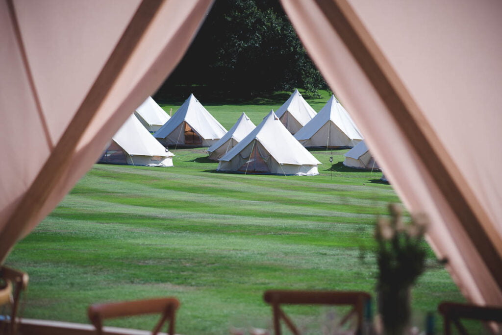 Group of bell tents as glamping area at a wedding