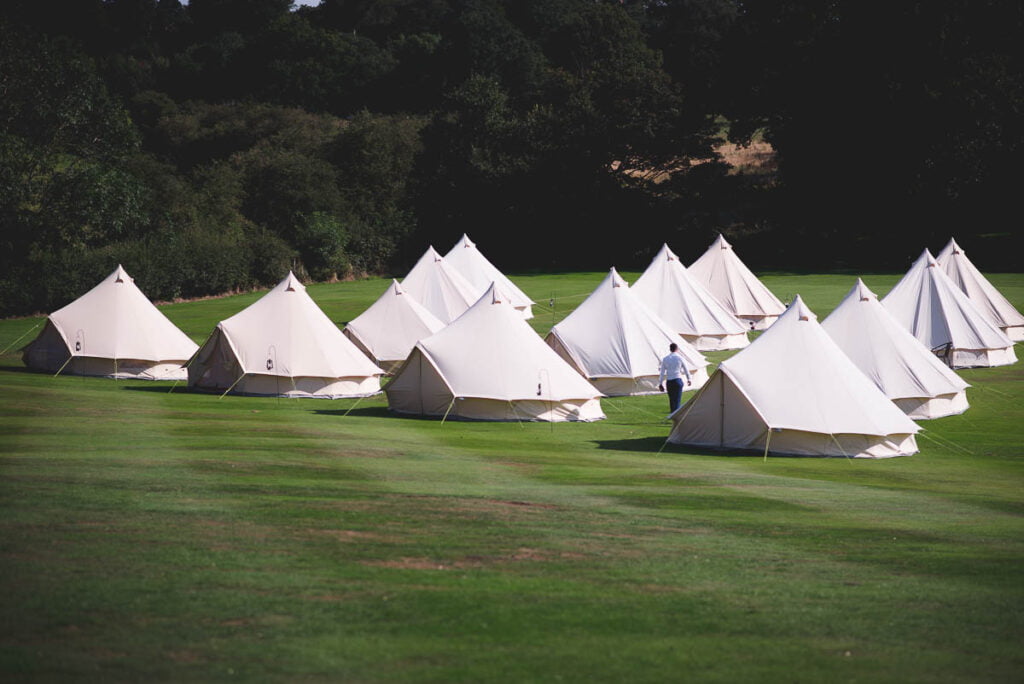 Group of bell tents as glamping area at a wedding